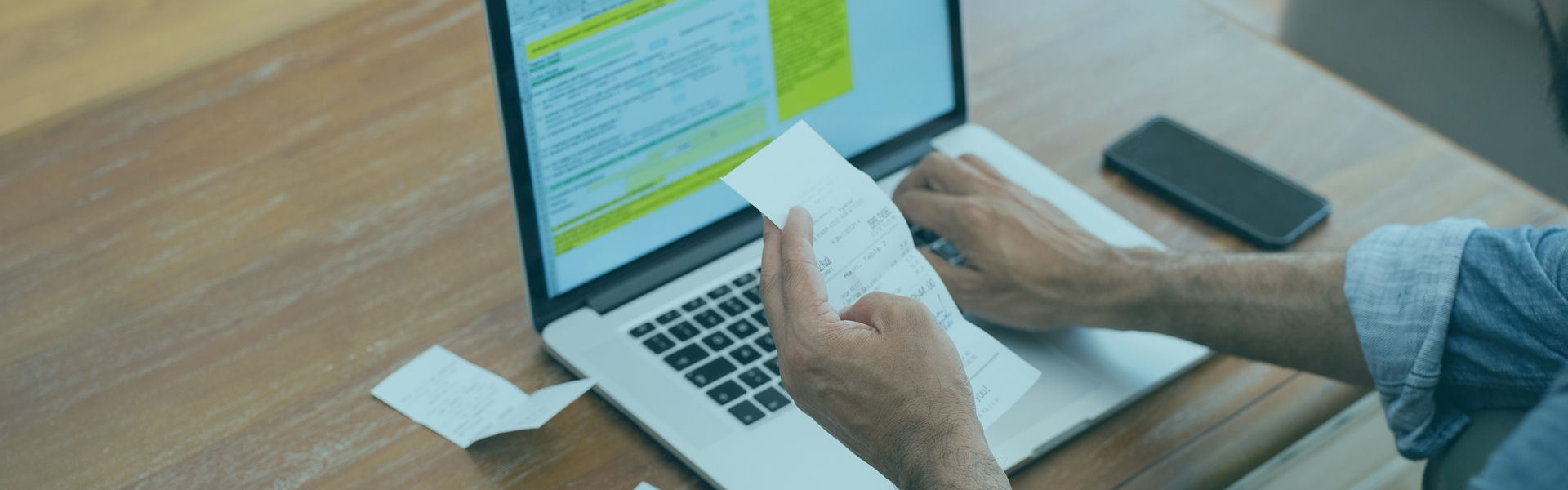 Person scanning receipts, making payment online